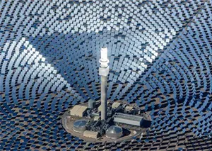 A concentrated solar power installation containing thousands of mirrors and an electricity generation tower in the middle.