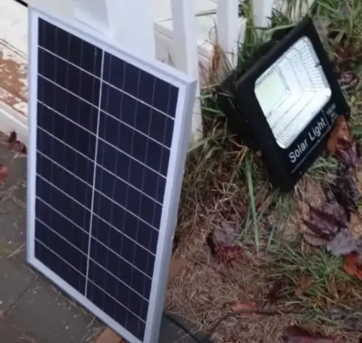 An outdoor solar floodlight powered by a single solar panel.