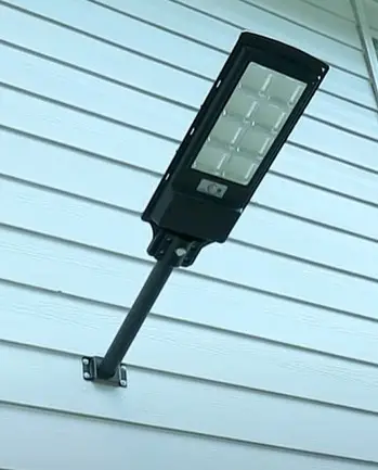ENGREPO Solar Outdoor Flood Light mounted to house