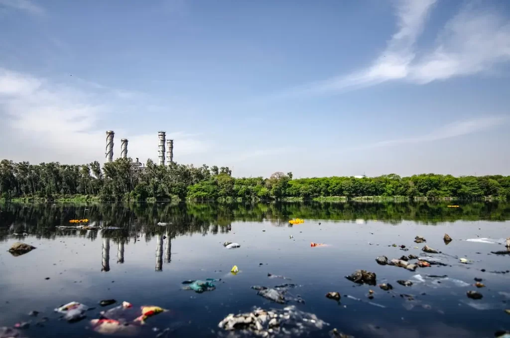 Garbage floating in a waterway in India - a land suffering from the effects of air, soil, and water pollution.