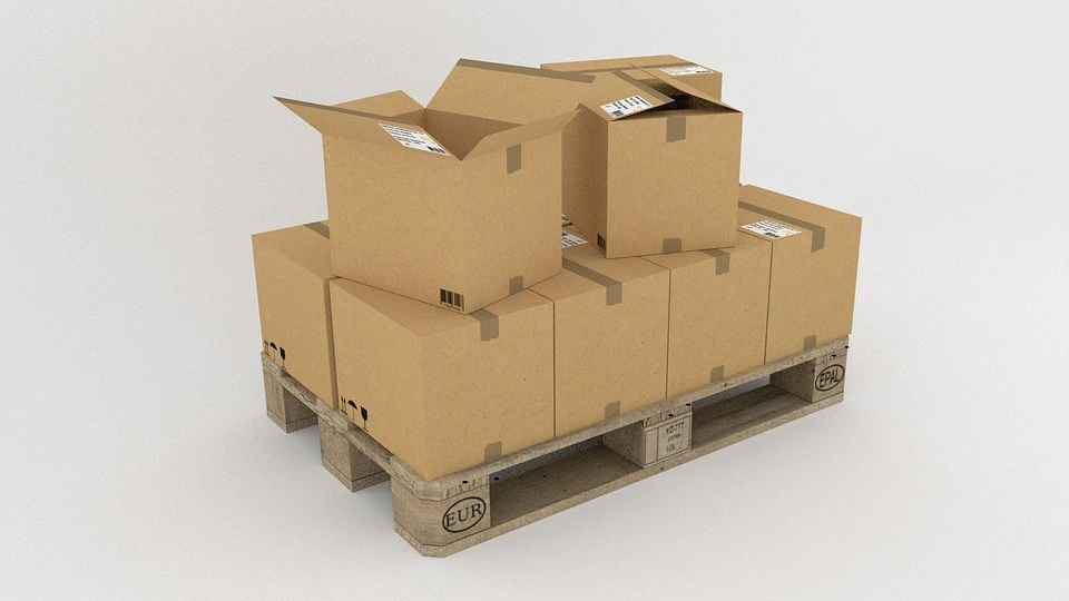 A pallet of cardboard boxes that are made thinner due to source reduction which saves paper resources.