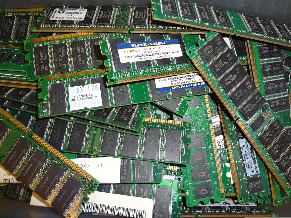 A pile of electronic chips and boards that are full of recyclable materials.