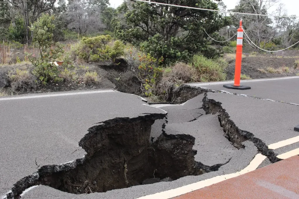 A sinkhole in a highway in Hawaii that has been opened up by a small earthquake.