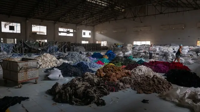 A textile recycling business in Cambodia that sorts, shreds, and turns old textiles into new yarn.
