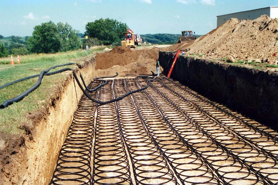 A mass of coiled water tubing that will be buried underground to provide passive geothermal heating and cooling.