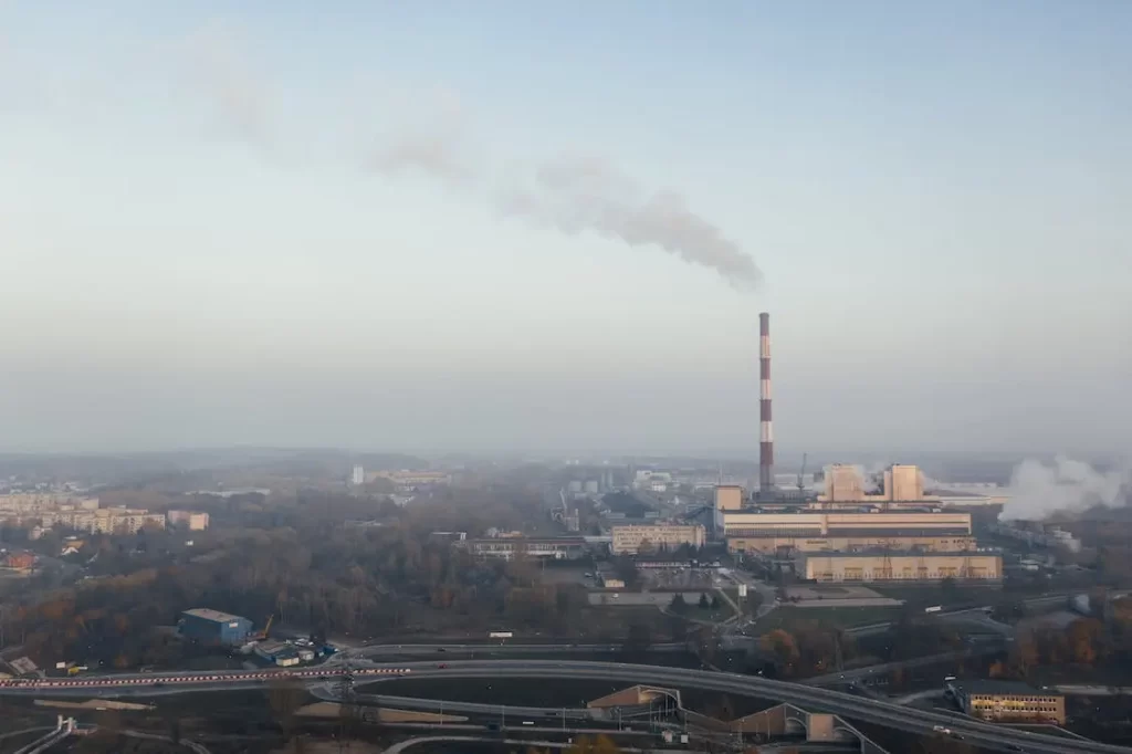 A city under clouds of pollution made of greenhouse gases.