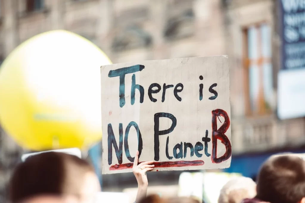 A sign from a protestor saying there is no Planet B trying to fight Climate change