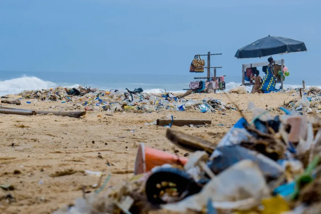 A beach that's polluted with piles of trash.